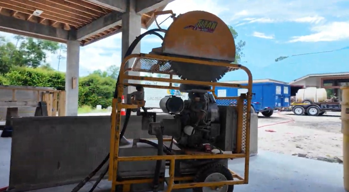 Remove It Pros crew using a Titan concrete saw for concrete cutting in Southwest Florida