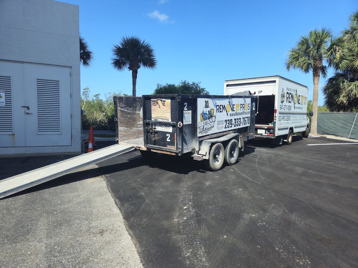 Remove It Pros box truck and dump trailer loaded and ready before a selective demolition job in Southwest Florida