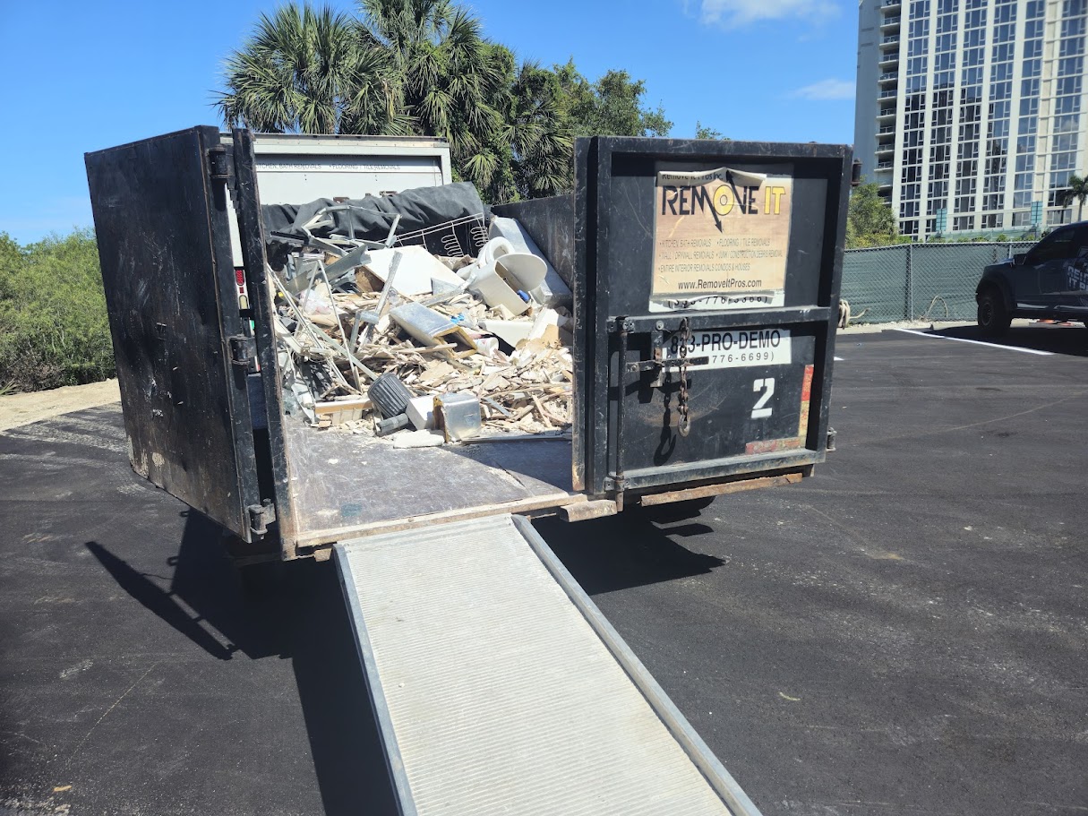 Remove It Pros dump trailer loaded with debris during a selective demolition job