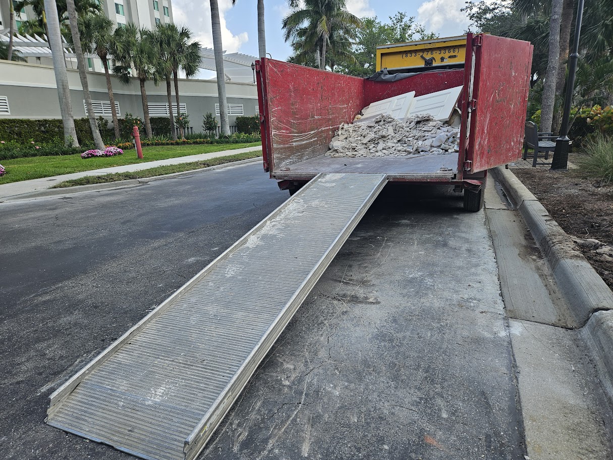 Remove It Pros dump trailer loaded with debris during a selective demolition job